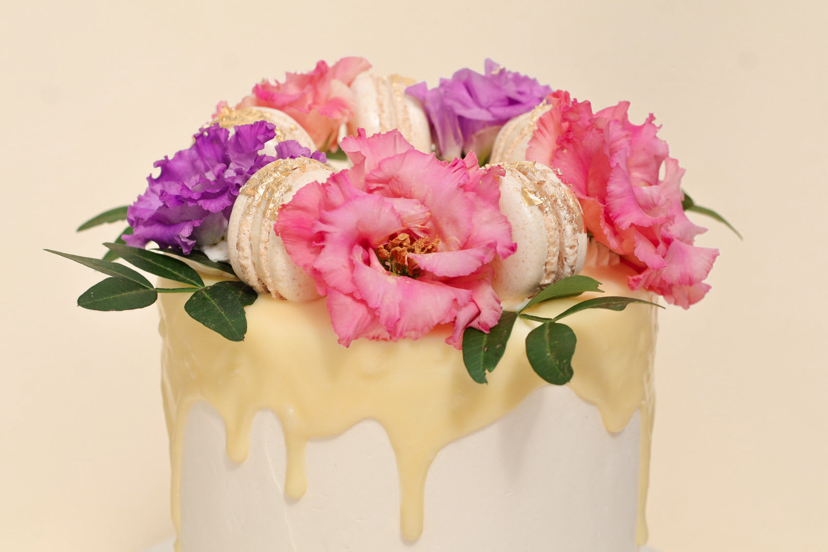 Signature Raspberry & Orange Floral Drip Cake